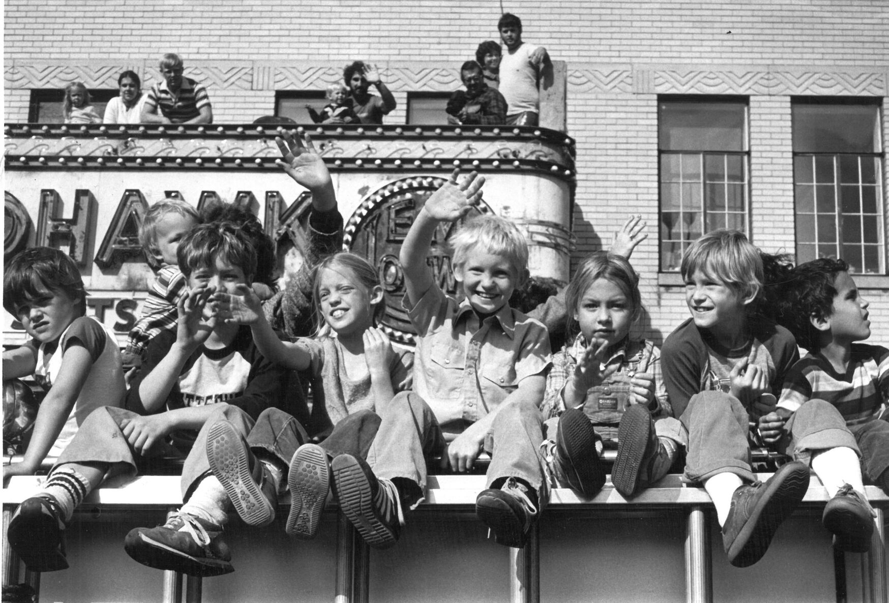 Riding high above the crowd lining Main Street.